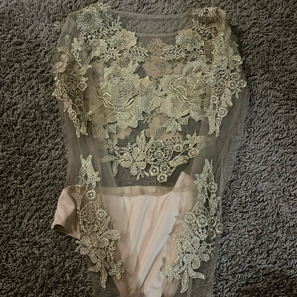 Beautiful tan mesh shirt with embroded flowers attached